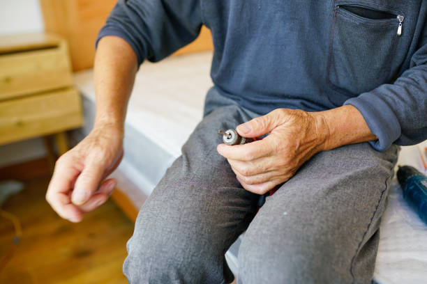 istock one old man in his bedroom with hammer and screwdriver 1911746051