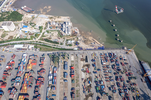 Aerial view of container freight terminal from high altitude