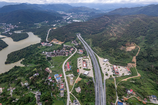 A bird's-eye view of highways passing through mountains and rural areas