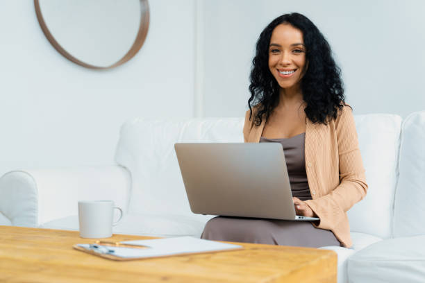 istock African-American woman using laptop computer for crucial work 1911796175
