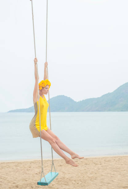 portrait of young woman in swing - bay wreath zdjęcia i obrazy z banku zdjęć