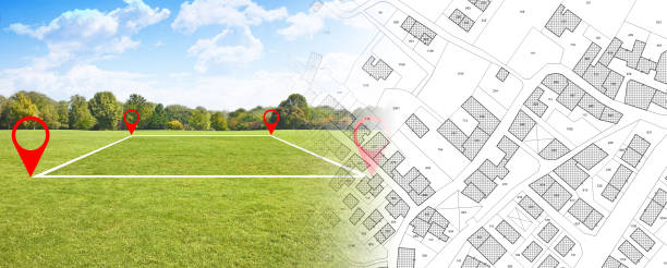 istock Land plot management - real estate concept with a vacant land on a green field available for building construction in a residential area against an imaginary cadastral map 1911805040