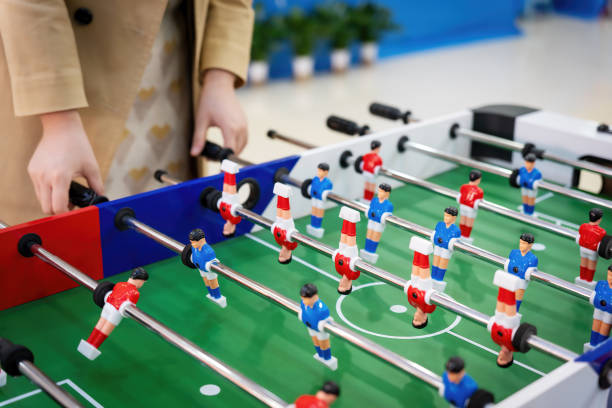 istock Young people playing table football game 1911818582