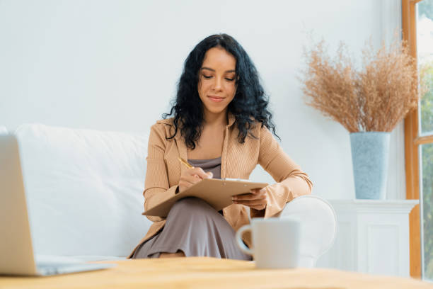 istock African-American woman using laptop computer for crucial work 1911835282