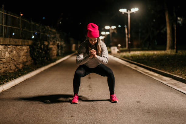 istock young woman exercising at night 1911838014