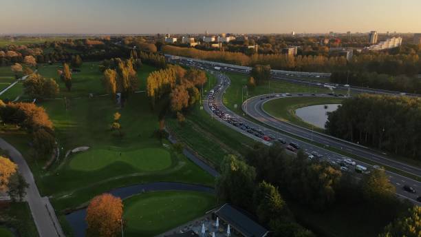 istock Amsterdan north intersection between N247 and the A10 Ringweg north, the highway where evening rush hour traffic stands on the highway. Commuters going home. 1911846204