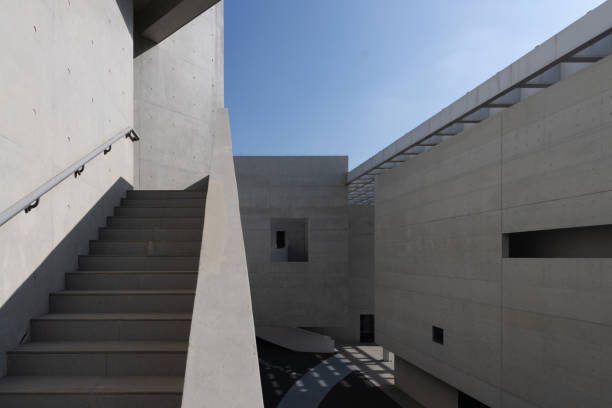 istock Undecorated cement walls and stairs in modern architecture 1911868216