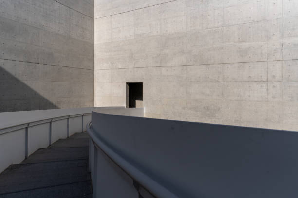 istock Undecorated cement walls and stairs in modern architecture 1911868219