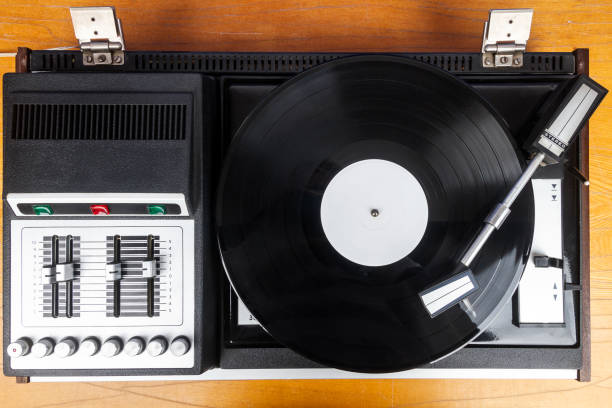 istock Vintage turntable vinyl record player with black vinyl 1911888446