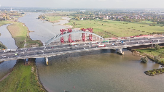 Aerial drone view of dutch infrastructure highway overpass over waterway river, Jan Blankenbrug A2 highway under construction. Overview