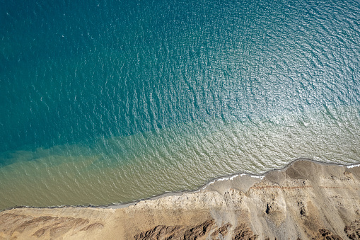 Aerial view of a pure lake and barren land