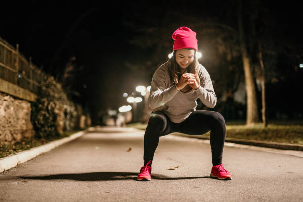 istock young woman exercising at night 1911959073