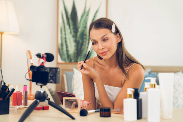 istock Young woman making beauty and cosmetic tutorial video content. Unveiling 1912001809