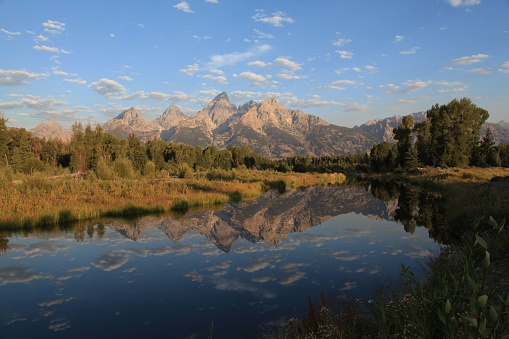 A scenic view of Schwabacher Landing at Grand Teton National Park, Wyoming in sunrise
