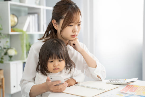 istock Concerned Mother Planning for Child's Education Expenses 1912071851