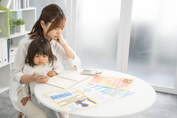 istock Concerned Mother Planning for Child's Education Expenses 1912071852