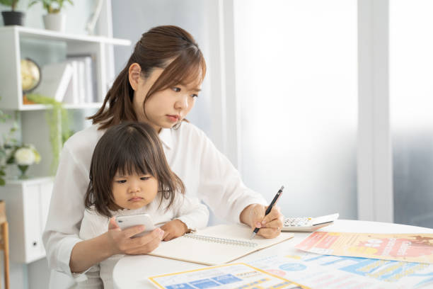 istock Concerned Mother Planning for Child's Education Expenses 1912071853