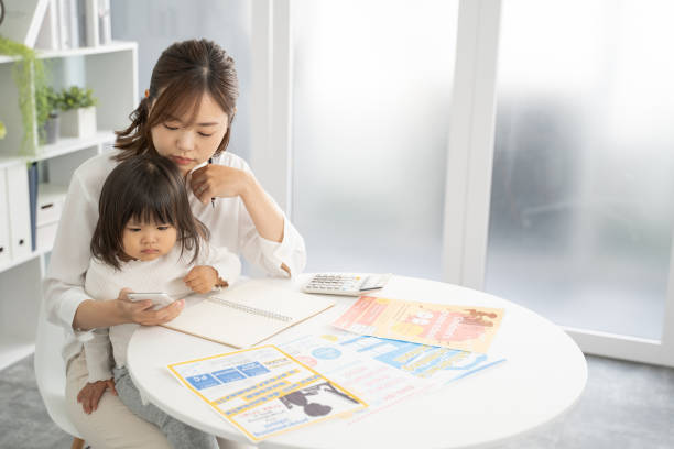 istock Concerned Mother Planning for Child's Education Expenses 1912071854