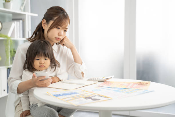 istock Concerned Mother Planning for Child's Education Expenses 1912071855
