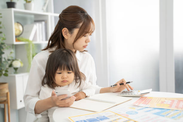 istock Concerned Mother Planning for Child's Education Expenses 1912072360