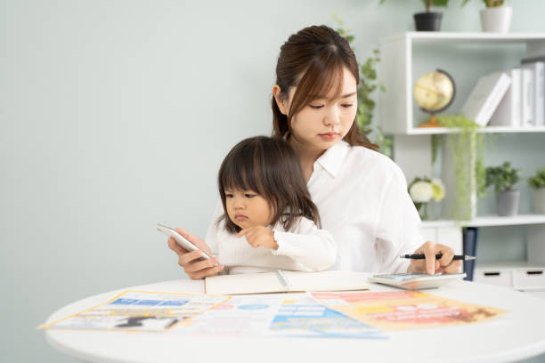 istock Concerned Mother Planning for Child's Education Expenses 1912072918