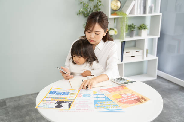 istock Concerned Mother Planning for Child's Education Expenses 1912072919