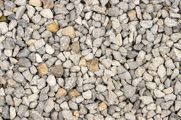istock Shallow focus on small gravel, creating a unique road texture pattern. 1912100369