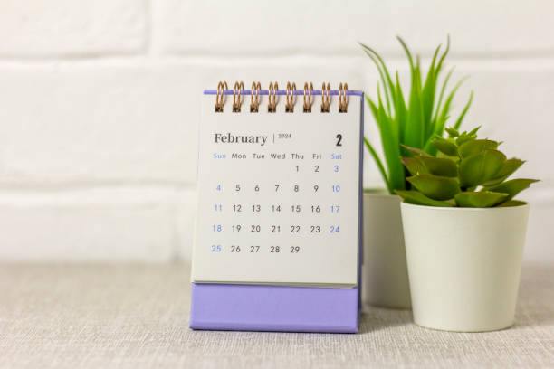 istock Desk calendar for February 2024 and on the table with copy space. 1912114539