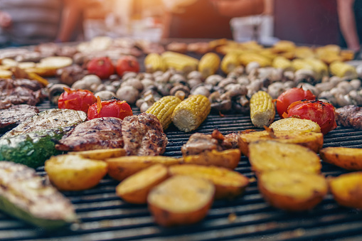 grilled vegetable and meat on barbecue at food fest or festival outdoor