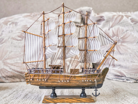 Model of a sailing ship on a light beige background