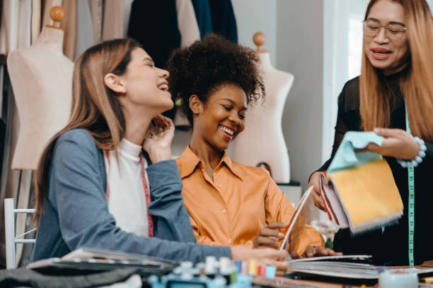istock multi-ethnic designer group Discusses and exchange ideas for clothing design with intention and happiness. 1912184425
