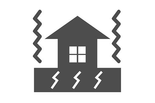 Icon of a house shaken by an earthquake.