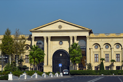 Baku, Azerbaijan: Neo-classical façade of the Presidential Palace, known as the President's Urban Residence - Koroghlu Rahimov Street (the Executive Office of the President is on a Soviet building on Niyazi Street). According to the 1995 constitution, Azerbaijan is a republic with a presidential system of government, although the office of prime minister exists. The president is endowed with extensive executive powers and, following a constitutional referendum in 2016, is elected directly for seven years. Since 2009, the presidential term of office is no longer limited to two terms and, in times of military operations, can be extended until the end of these operations.