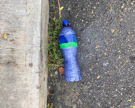 High angle view of plastic bottle in the street in a suburb of Caracas city