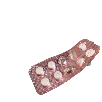 Close up view of blister of pills for headache on white color background