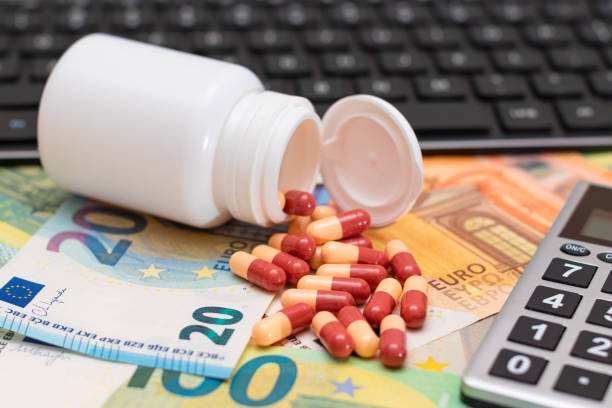 istock Ordering Medicines. Pills and Capsules on the Euro Banknotes 1912240647