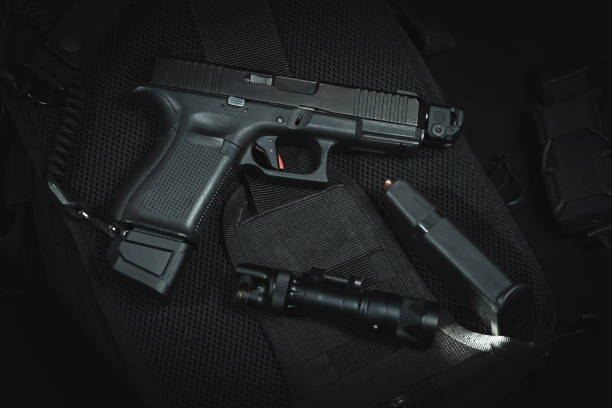istock Tactical pistol g19 with muzzle compensator and extended magazine and weapon flashlight. 1912260108