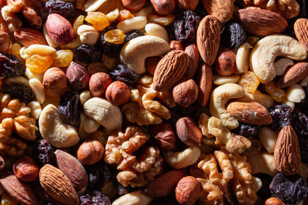 istock Mixed Nuts: Almonds, Walnuts, Cashews, Peanuts, Hazelnuts, Dried Prunes and Raisins 1912276307