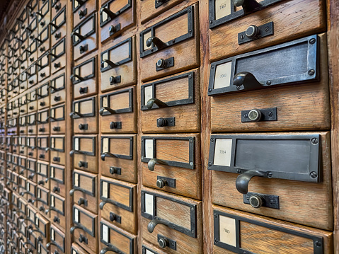 The drawers in an extensive card catalog system stretch into the distance in a New Haven library.