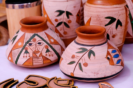 Collection of images with unglazed handmade pottery pot made of red clay. Teracota vase. Pottery basics. Sale in Pune, India, handcraft fair.