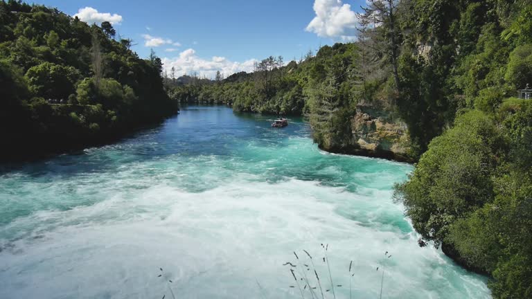 View from the top on massive waterfall flow with azure water, Full HD, New Zealand