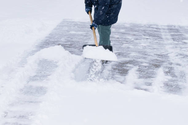 istock an unrecognizable man cleans snow with a shovel in a snowfall 1912447397