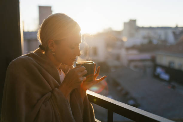 istock A young woman drinking coffee on balcony 1912490164