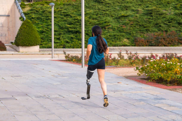 istock Runner with prosthetic leg running along a park 1912490176
