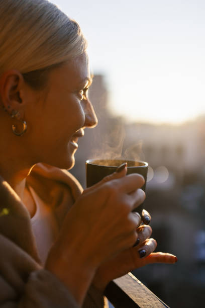istock A young woman drinking coffee on balcony 1912490690