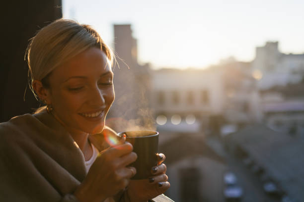 istock A young woman drinking coffee on balcony 1912490694