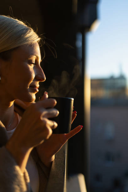 istock A young woman drinking coffee on balcony 1912490703