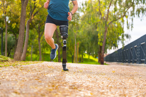 istock Legs of a man with prosthesis running along a park 1912515748