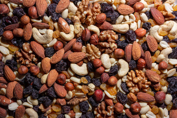 istock Mixed Nuts: Almonds, Walnuts, Cashews, Peanuts, Hazelnuts, Dried Prunes and Raisins 1912542155