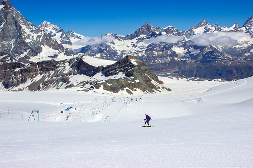 one teenage girl skiing in the swiss alps during summer, Zermatt Switzerland